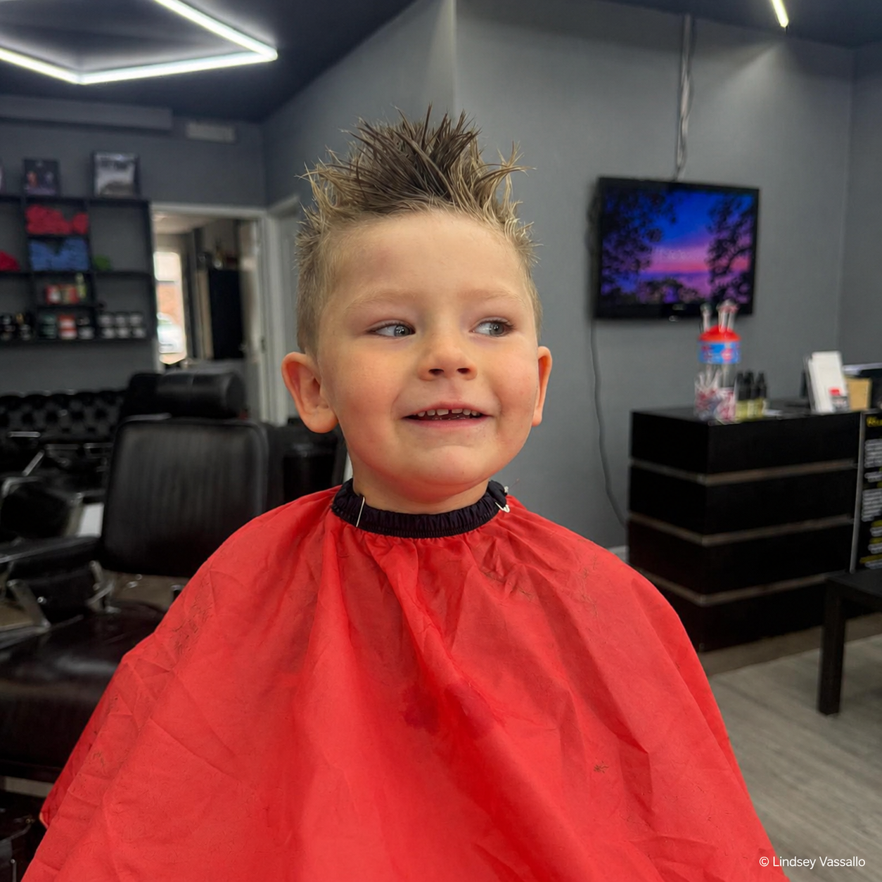 A child enjoying a haircut during a trip out